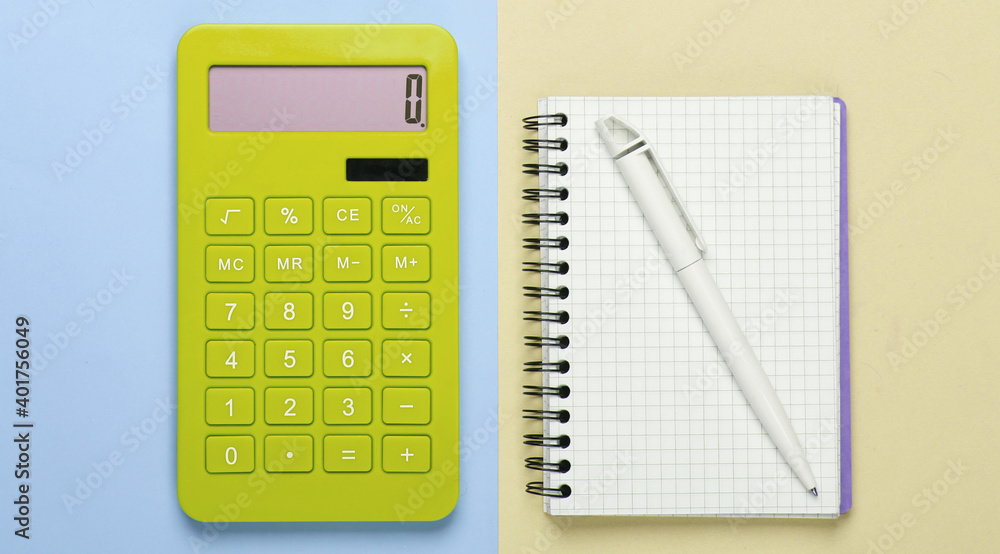 Calculator with a notebook on a blue-yellow pastel background. Education process. Top view. Flat lay Calculator with a notebook on a blue-yellow pastel background. Education process. Top view. Flat lay