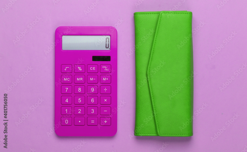 Manage family budget. Shopping costs. Pink calculator with green leather wallet on pink background. Top view Manage family budget. Shopping costs. Pink calculator with green leather wallet on pink background. Top view