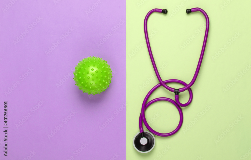 Diagnosis of coronavirus, pneumonia. Stethoscope with a strain of virus on pink green background Diagnosis of coronavirus, pneumonia. Stethoscope with a strain of virus on pink green background