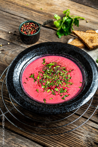 Traditional Russian Ukrainian borscht red soup with rye bread. Homemade Russian, Ukrainian and Polish national soup. vertical image