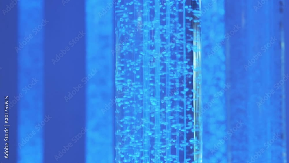 Blue bubbles flowing in tube in slow motion 180fps Blue bubbles flowing in tube in slow motion 180fps