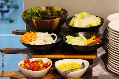 Fresh fruits and vegetables in bowls ready for breakfast