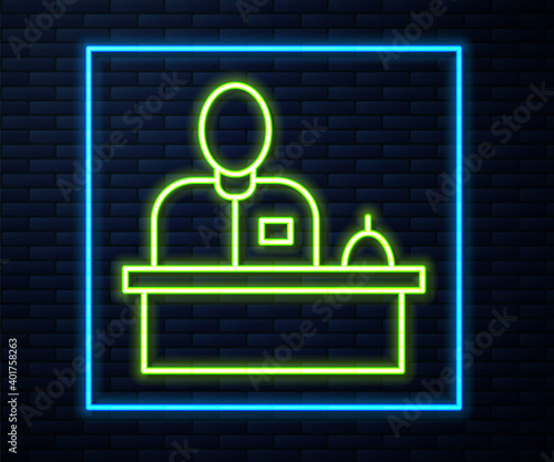 Glowing neon line Receptionist standing at hotel reception desk icon isolated on brick wall background. Vector.
