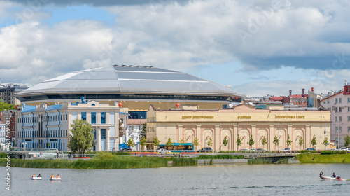 KAZAN, RUSSIA - June, 2020. Lake Nizhny (Lower) Kaban embankment, Altyn electronics center, reeds, grass in the water. Kazan, Tatarstan © Alexei Uzinskii