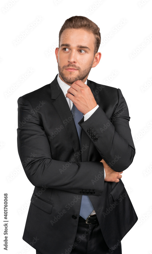 Businessman in black suit standing on isolated over white background. Young businessman thinking hand to chin, thoughtful look Businessman in black suit standing on isolated over white background. Young businessman thinking hand to chin, thoughtful look