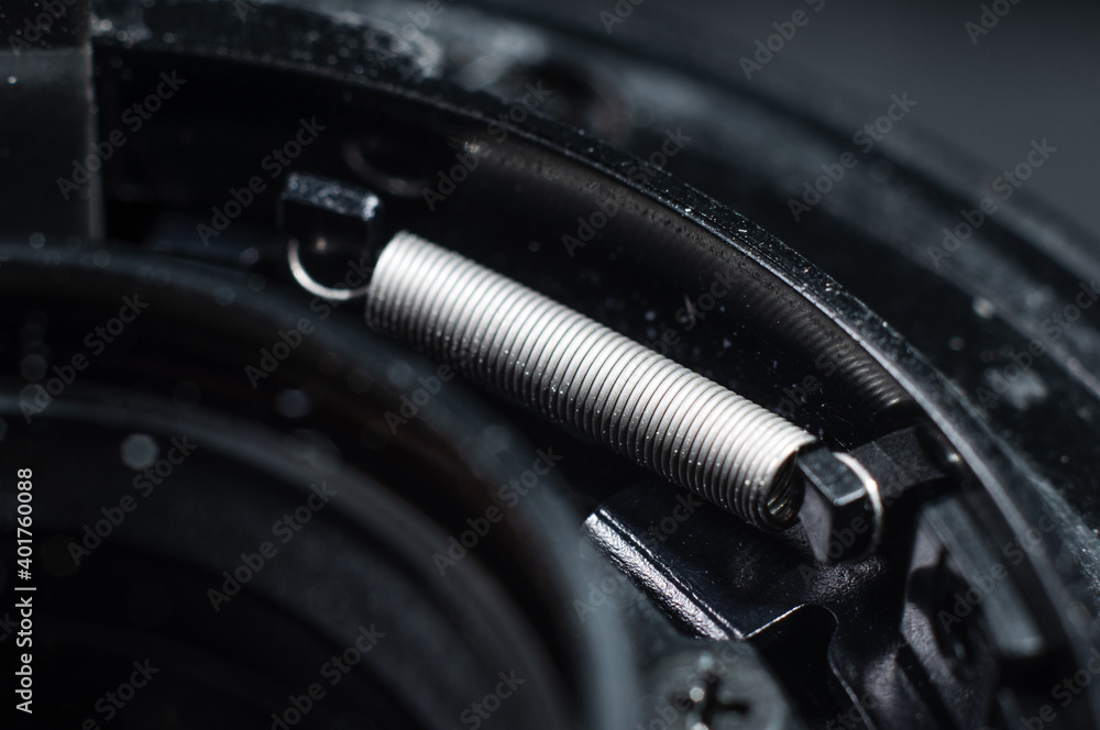 Spring fixing the lens in the camera bayonet close-up, macro photography Spring fixing the lens in the camera bayonet close-up, macro photography