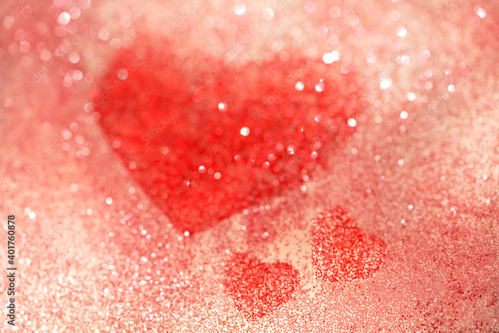 Pink and red background with one big heart and two small ones and bokeh with outlines. Abstract background for Valentine's day.
