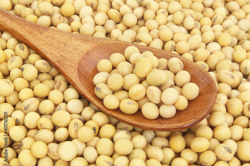 Soy beans with wooden spoon close up