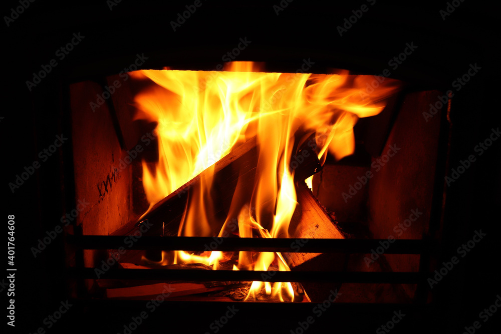 Fire burning bright in a furnace in winter Fire burning bright in a furnace in winter
