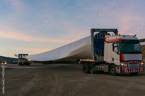 Special transport of blades for wind turbines, truck transporting a wind turbine blade that due to its large size requires a special adapted semi-trailer and accompanying vehicles (or galibos) for saf