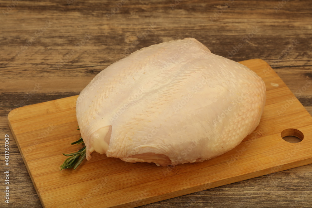 Raw whole chicken breast with skin Raw whole chicken breast with skin