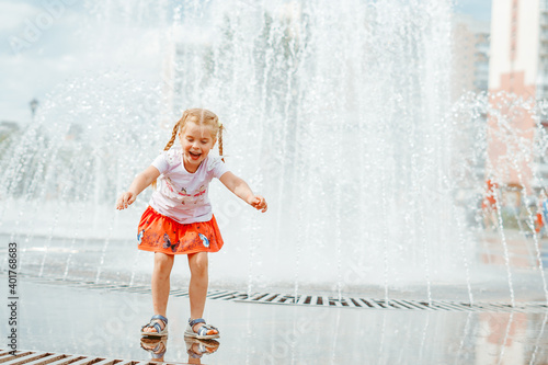 little girl near the fountain