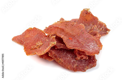 Spicy dry-cured meat isolated on a white background.