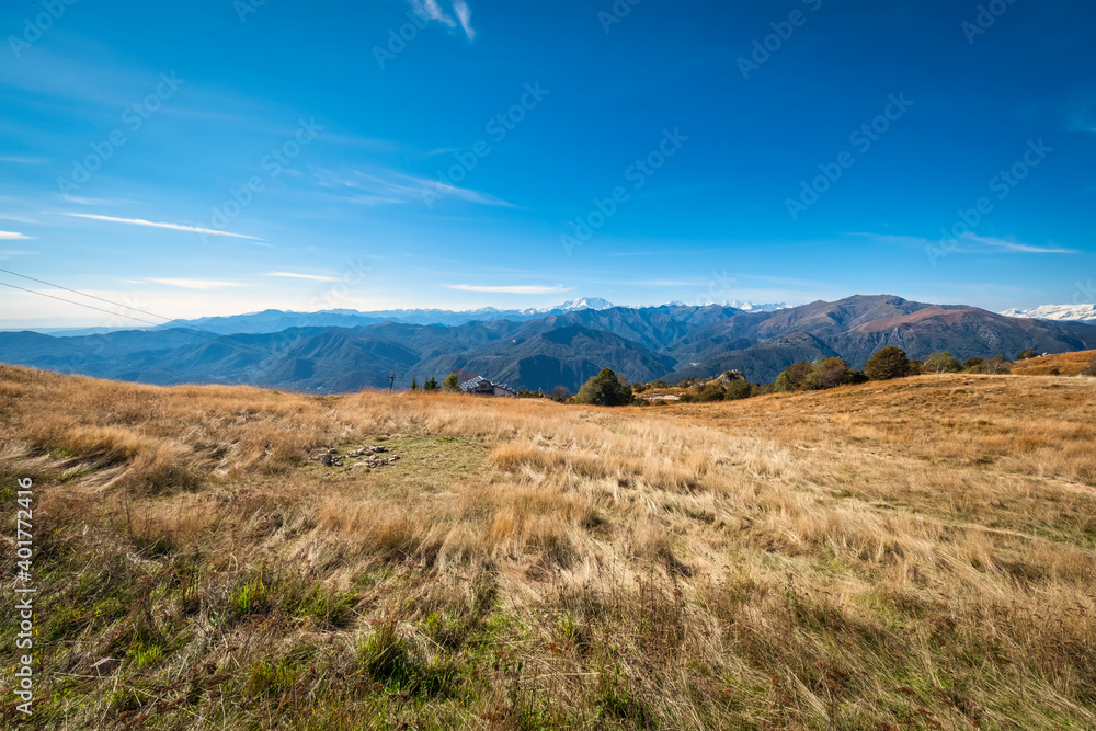 Fototapeta premium View of the mountains range of Italy and Switzerland, seen from the peak of Mottarone mountain (Piedmont, Northern Italy), early fall season.