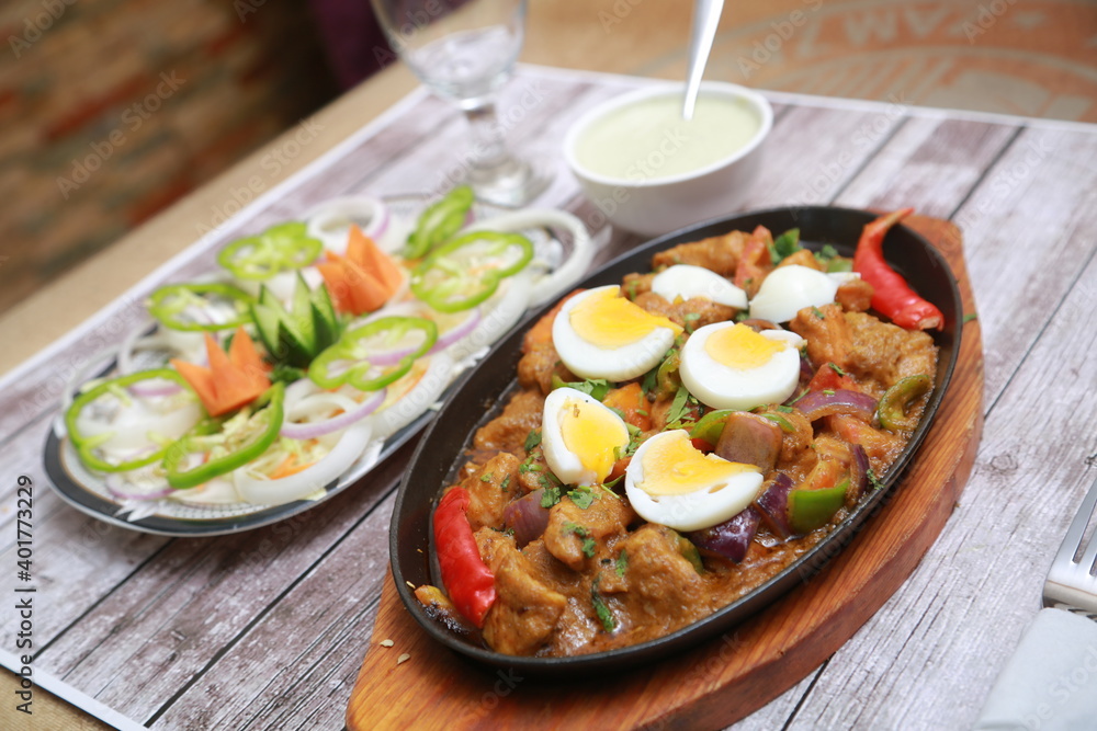 Chicken 65 sixty five with salad on wooden background Chicken 65 sixty five with salad on wooden background