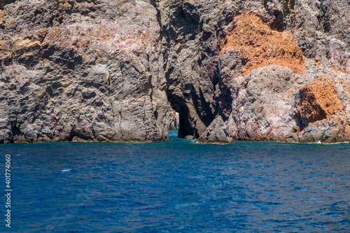 View of the rocks cliffs of the Aeolian Island, group of small volcanic islands, located in the Mediterranean Sea, between the shores of Sicily and Calabria Regions (Southern Italy). photo