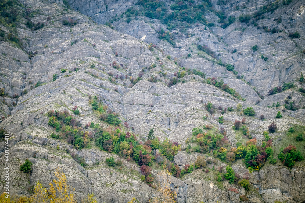 Late fall view of the textured rocks surrounding the Borbera creek, in the same name valley (Piedmont, Northern Italy), near the border between Piedmont and Liguria regions.