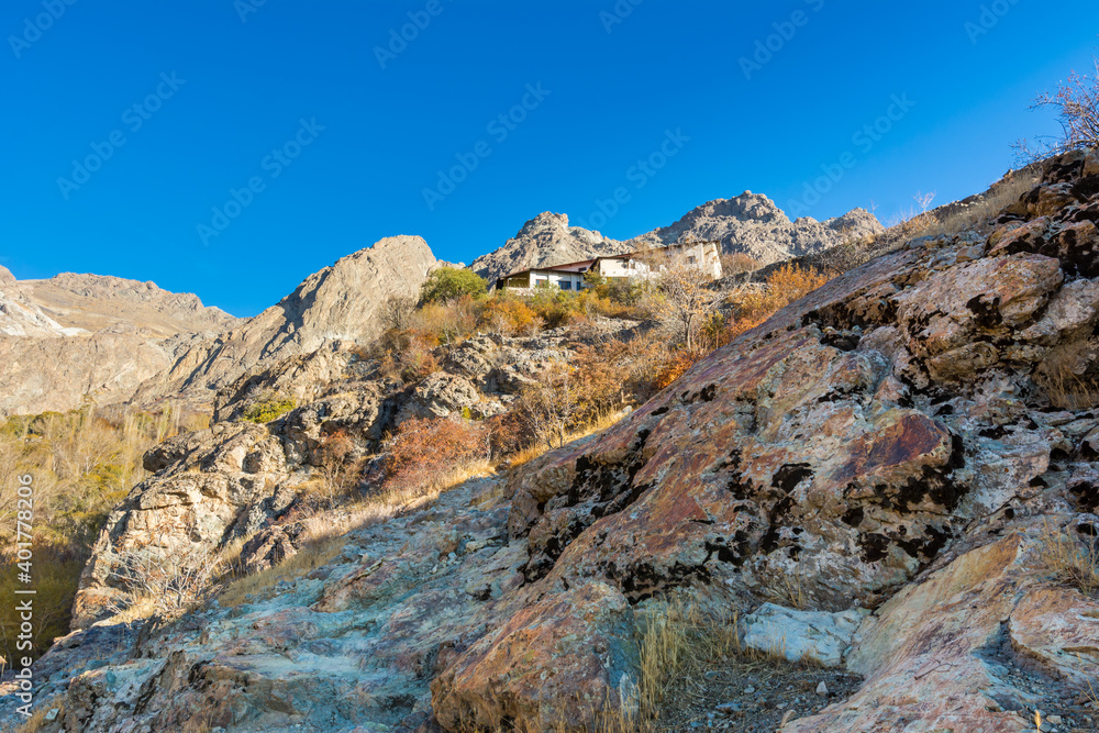 Barren mountain in Darband valley in autumn in the morning against blue sky in the Tochal mountain. A popular recreational region for Tehran's residents