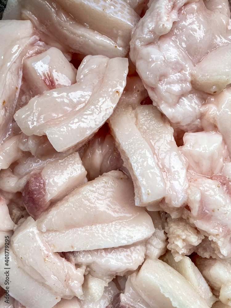 Raw pig's fat prepared and cut out on the little pieces for roasting on the traditional Croatian way. Raw pig's fat prepared and cut out on the little pieces for roasting on the traditional Croatian way.