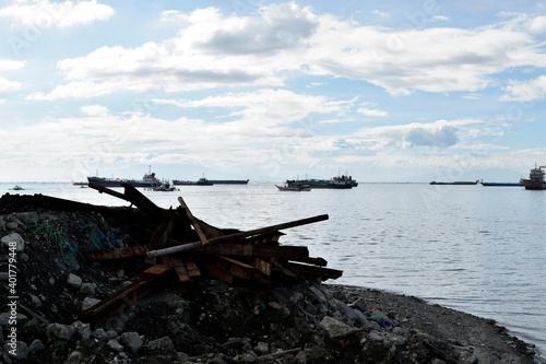 metal scraps scattered along the ocean coast