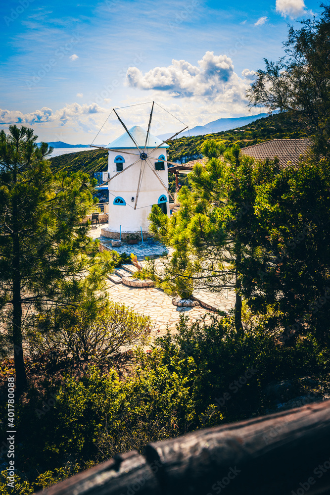 Windmills on Zakyntos in the Ionian Sea. This beautiful old windmill is in the north of Zante and is a hotel. White greece Typical. Taken in the morning, blue sky Windmills on Zakyntos in the Ionian Sea. This beautiful old windmill is in the north of Zante and is a hotel. White greece Typical. Taken in the morning, blue sky