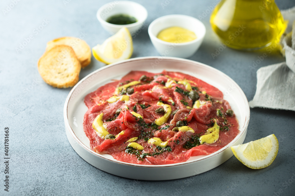 Homemade beef carpaccio with mustard sauce Homemade beef carpaccio with mustard sauce