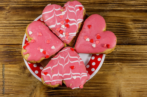 Fototapeta Naklejka Na Ścianę i Meble -  Heart shaped cookies on wooden table. Top view. Dessert for Valentine day