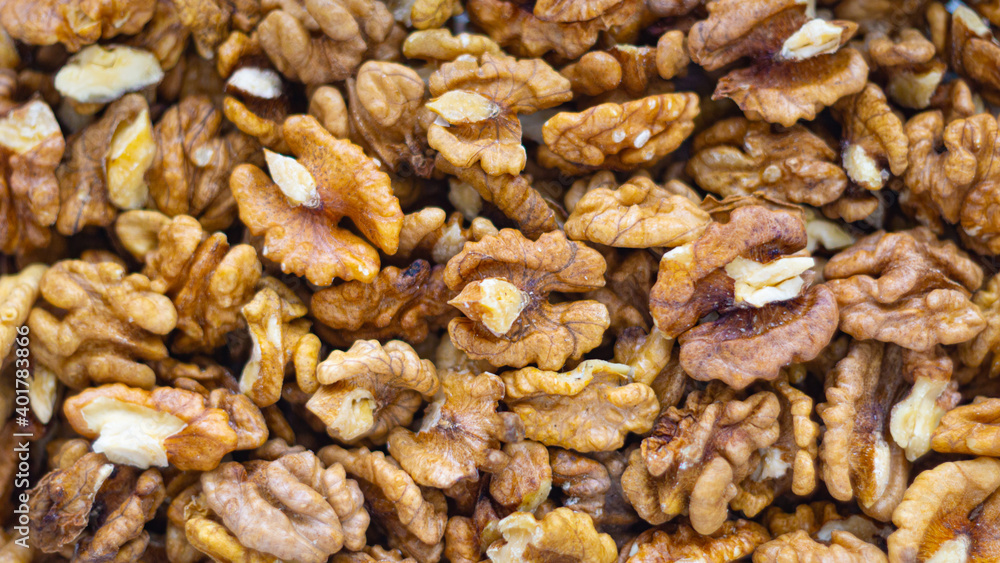 Background of walnuts close up from above healthy food concept