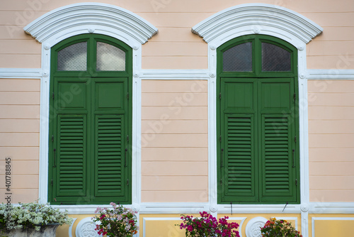 Double wooden shutters Old vintage style exterior decoration  green windows