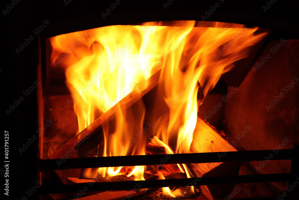 Fire burning bright in a furnace in winter Fire burning bright in a furnace in winter