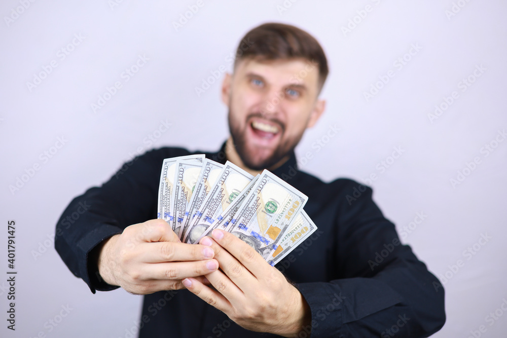 a male businessman holds banknotes in his hands a male businessman holds banknotes in his hands