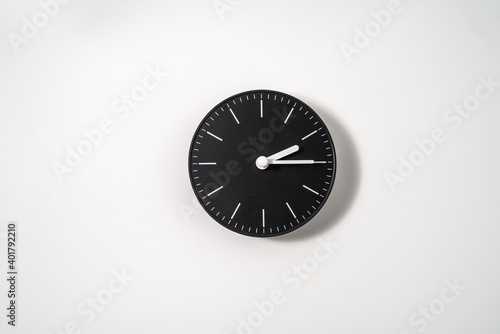 close up of an office clock on white background with clipping path