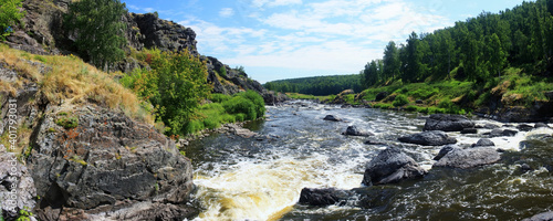 Mountain river flows in a stone gorge