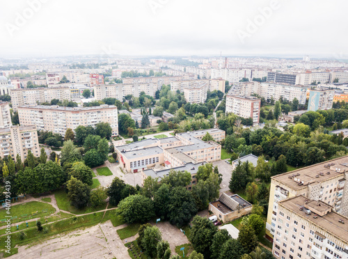 Aerial view of town with socialist soviet panel building at cloudy day. Buildings were built in the Soviet Union now Ukraine. The architecture looks like most post-soviet commuter towns.