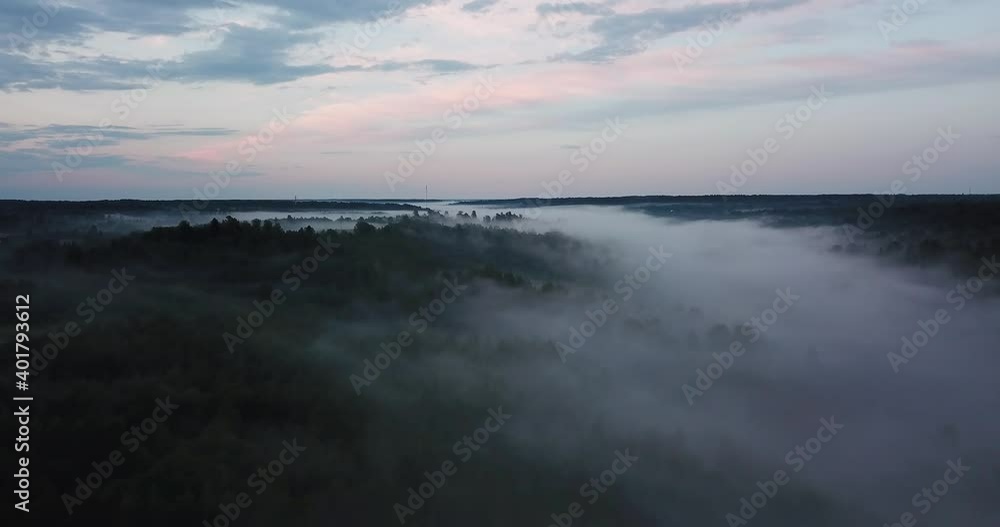 Autumn forest aerial. Low clouds of fog over trees. Misty weather, colorful woods. Drone flies through rain clouds moving over fall colors treetops in woodland. Foggy rainy day dramatic landscape. Autumn forest aerial. Low clouds of fog over trees. Misty weather, colorful woods. Drone flies through rain clouds moving over fall colors treetops in woodland. Foggy rainy day dramatic landscape.