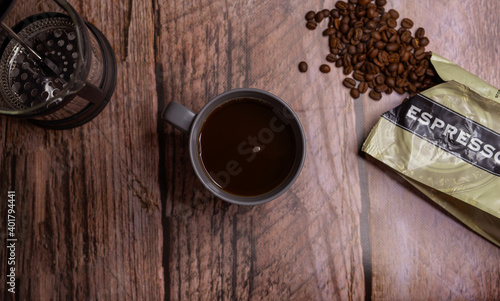 Flat lay Coffee cup with beans and strainer