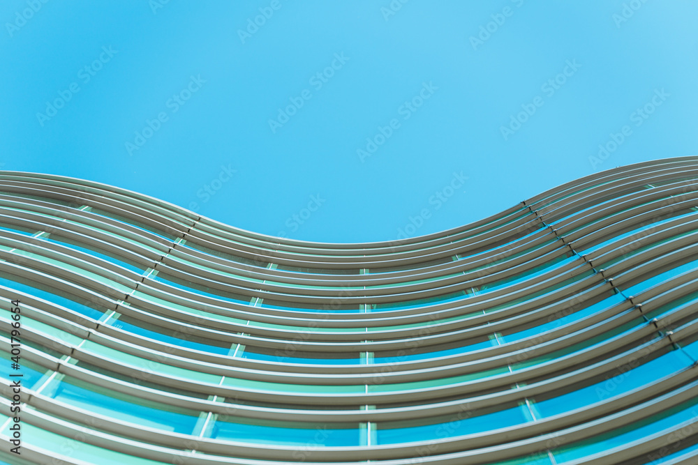 Obraz premium underside panoramic and perspective view to steel blue glass high rise building skyscrapers, business concept of successful industrial architecture