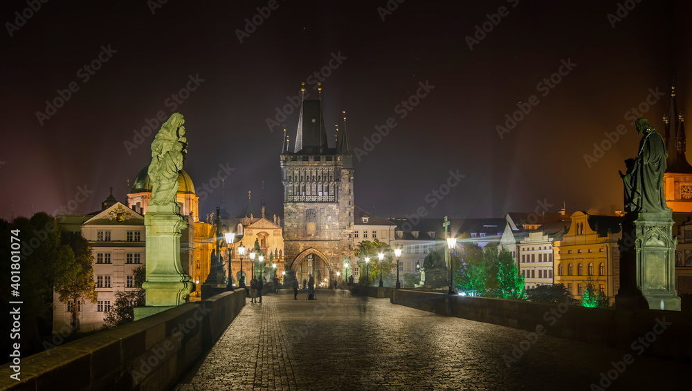 Charles Bridge (Karluv most) with Gothic statues in Prague old town, Czech Republic at night. Top sightseeing