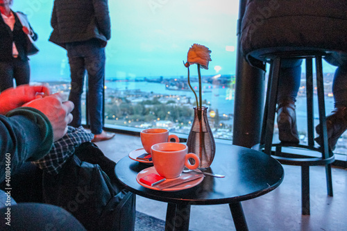 Photography People relaxing having coffee watching the view of Amsterdam from rooftop