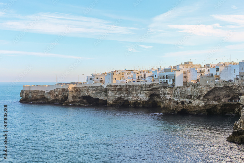 Beautiful view of the buildings on the rocks and view of the sea from Polignano a mare, province of Bari in Puglia, famous tourist destination in southern Italy.