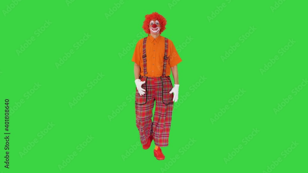 Funny clown with red hair walking comically on a Green Screen, Chroma Key. Funny clown with red hair walking comically on a Green Screen, Chroma Key.