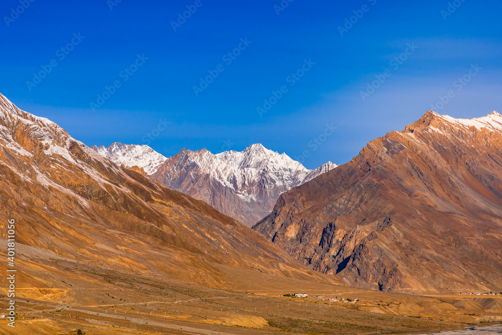 Serene Landscape of Spiti river valley and snow capped mountains during sunrise near Kaza town in Lahaul and Spiti district of Himachal Pradesh, India. Serene Landscape of Spiti river valley and snow capped mountains during sunrise near Kaza town in Lahaul and Spiti district of Himachal Pradesh, India.