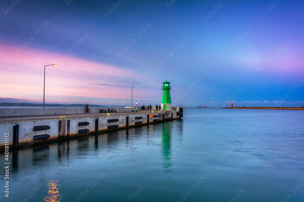 The lighthouse at the exit to the Baltic Sea in New Port at dusk, Gdansk. Poland