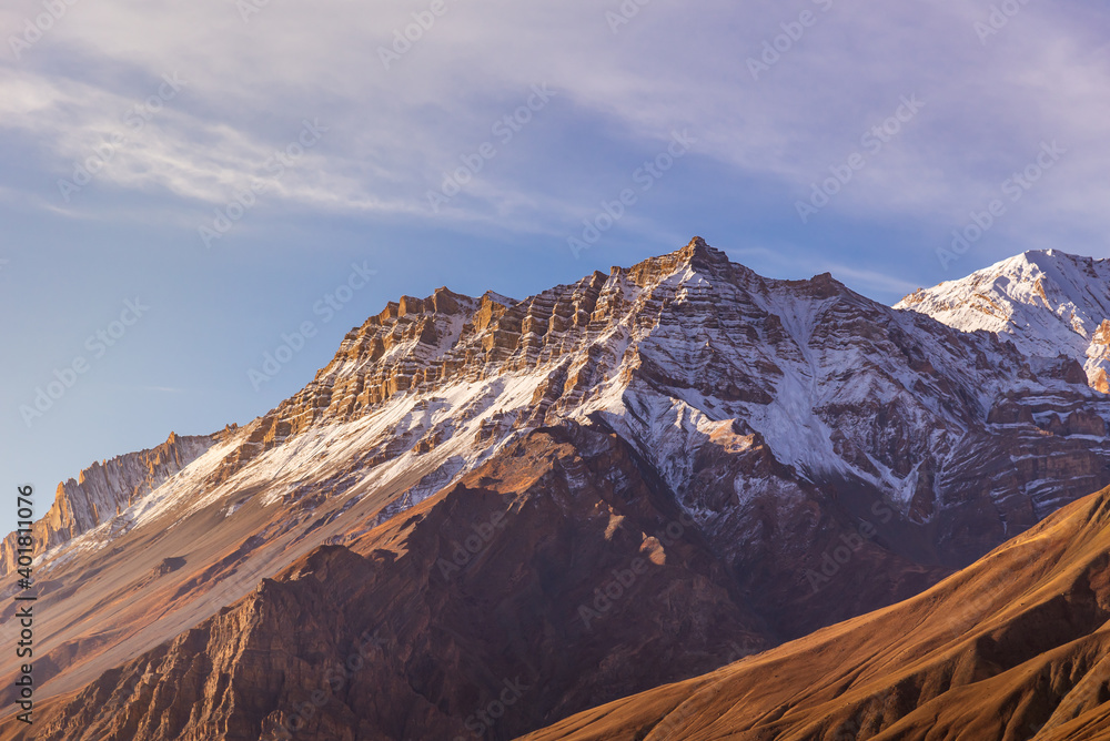 Serene Landscape of Spiti valley  and snow capped mountains during sunrise near Kaza town in Lahaul and Spiti district of Himachal Pradesh, India.