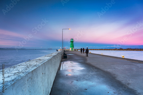 The lighthouse at the exit to the Baltic Sea in New Port at dusk, Gdansk. Poland