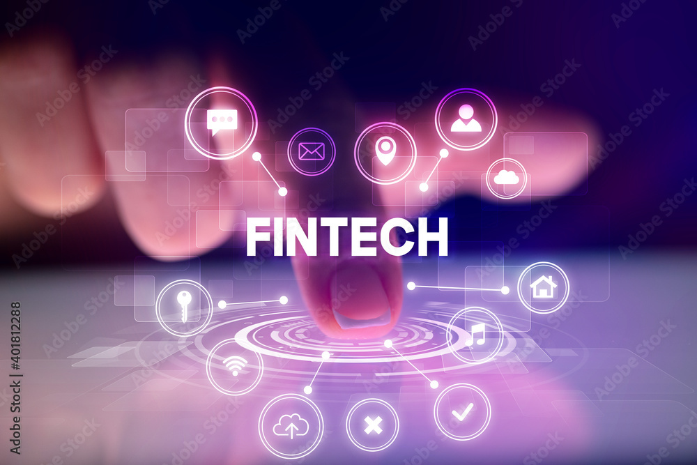Finger touching tablet with web technology icons and FINTECH inscription, web technology concept Finger touching tablet with web technology icons and FINTECH inscription, web technology concept