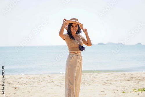 woman in dress on the beach