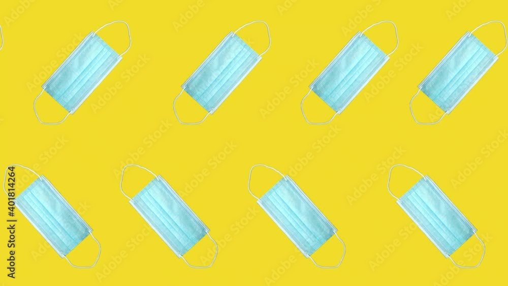 Pandemic 4k looped video. Motion design. Face masks moving on blue background. Virus protection Pandemic 4k looped video. Motion design. Face masks moving on blue background. Virus protection