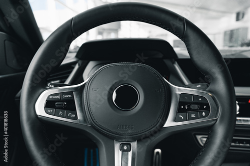 Canvas Print Steering wheel of a new luxury car