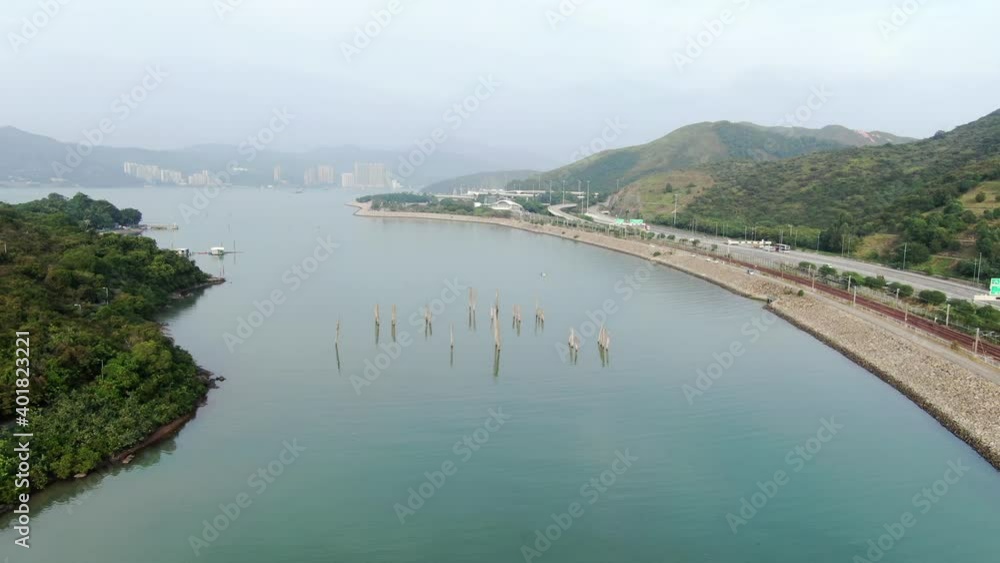 Hong Kong hidden bay in Lantau island with old Tree trunks sticking out of the water, Aerial view Hong Kong hidden bay in Lantau island with old Tree trunks sticking out of the water, Aerial view